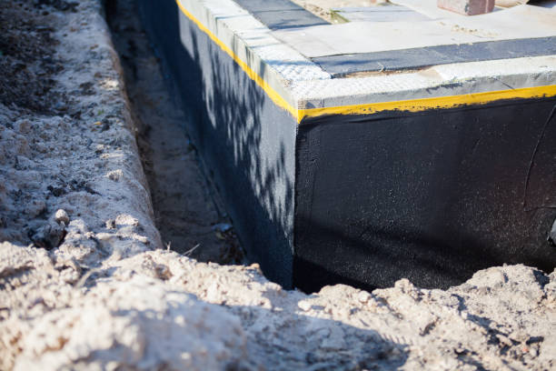 Professional Waterproofing technician working in Old Westbury, NY